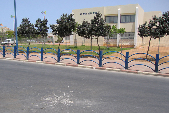 A school in Sederot with Qassam impact crater.