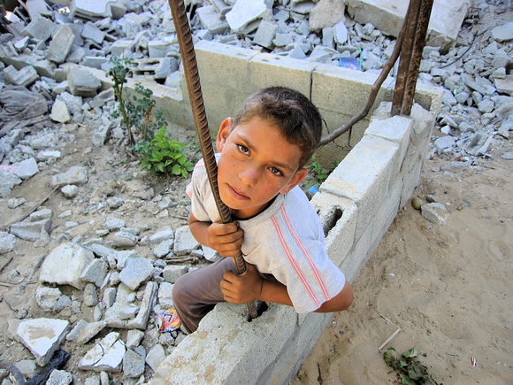 This boy's home was leveled by Israeli artillery.
